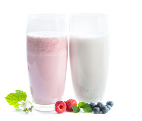 glasses of raspberry and blueberry milkshake