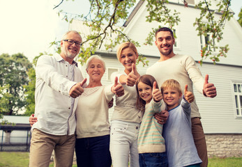 happy family in front of house outdoors