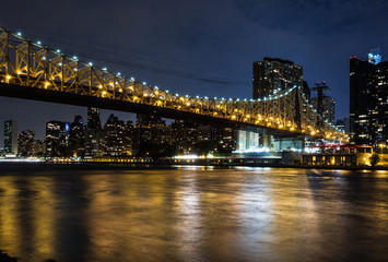 Fototapeta na wymiar New York by night: Queensboro Bridge, East River and Manhattan