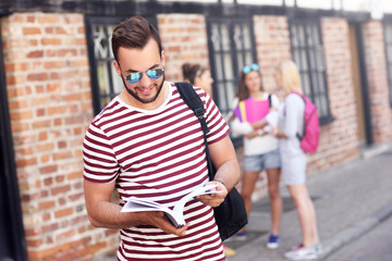 Fototapeta premium Group of happy students studying outdoors