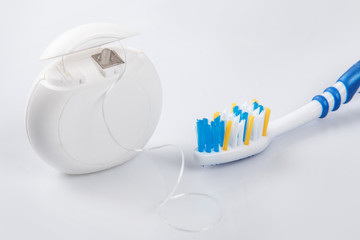Toothbrush and dental floss