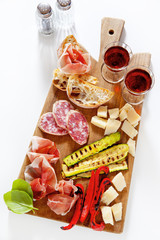 Italian healthy snacks. prosciutto, salami, vegetables grilled p