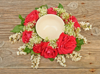 Fototapeta na wymiar Bouquet wreath of roses and spring flowers
