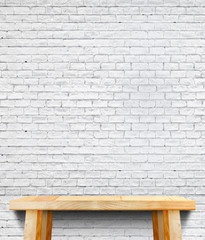Fototapeta na wymiar Empty wood table and white brick wall in background,Mock up temp