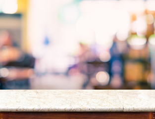 Empty marble table top and blurred coffee shop bokeh light in ba