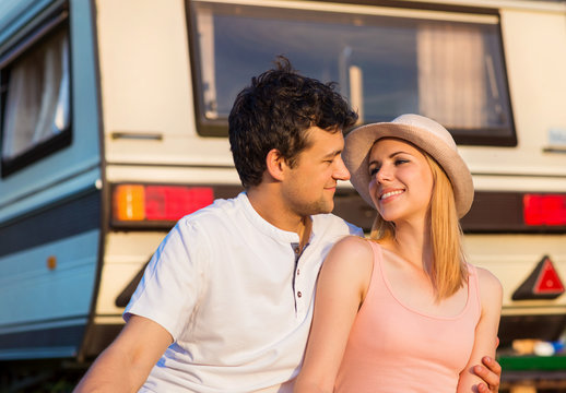 Young couple with a camper van