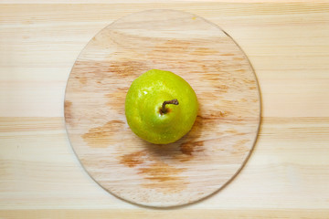 Ripe pear over wood table