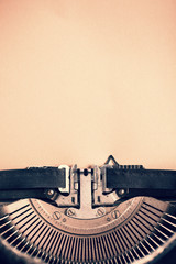 Detail of vintage typewriter with blank  paper