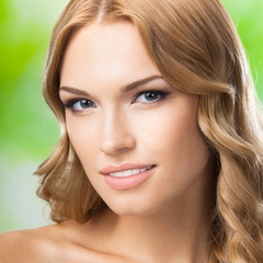 Fototapeta premium Portrait of young lovely blond woman, outdoors