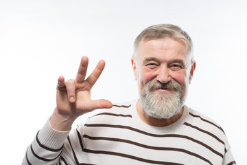 an old man with a beard raised his hand up