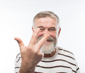 elderly man three fingers