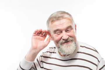 an old man with a beard is hard of hearing, health problems