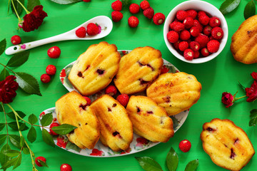 Madeleine cookies with wild strawberries. .