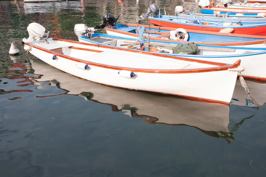 boats moored in the dock of Lake Garda