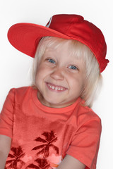 Smiling boy in a cap