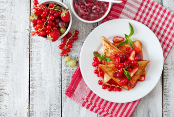 French toast with berries and jam for breakfast