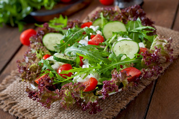 Useful dietary salad with cottage cheese, herbs and vegetables