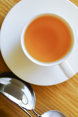 Cup of tea and sun glasses.