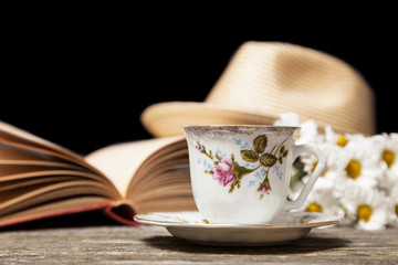 Coffee, daisies and a book