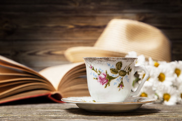 Coffee, daisies and a book