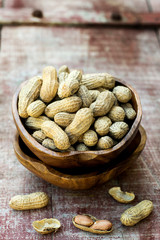 Peanuts in shell pod in bowl
