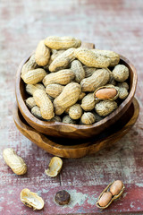 Peanuts in shell pod in bowl