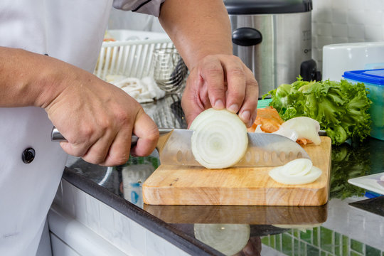 Chef chopping onion