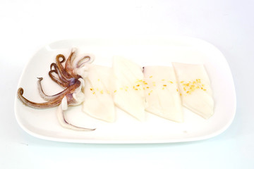 Raw squid slice on white dish isolate on white background ready