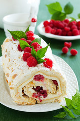 meringue roulade with cream and raspberries