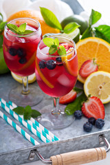Ice cold red sangria with citrus fruits