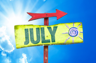 July sign with sky background