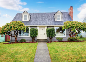 Authentic gray house with yard.