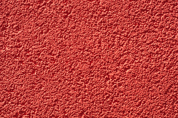 Modern house wall plaster. Red colour scheme.