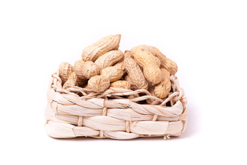 peanuts isolated in basket on white background