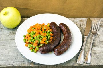 Sausages with vegetables and fruits