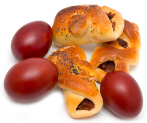 buns with painted eggs on a white background
