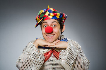 Funny clown against dark background