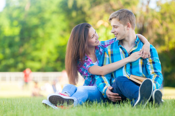 Young teen couple with notebook