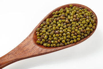 Green bean with wood spoon isolated on white background