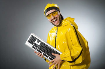 Man wearing yellow suit with keyboard