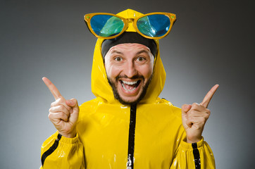 Man wearing yellow suit in funny concept