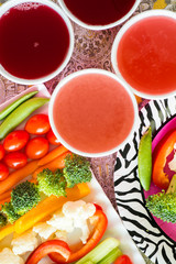 Vegetable tray and lemonade.