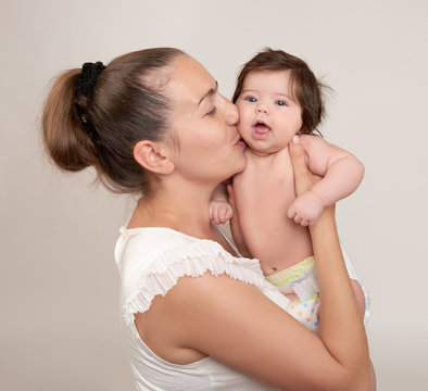 mother and baby on white