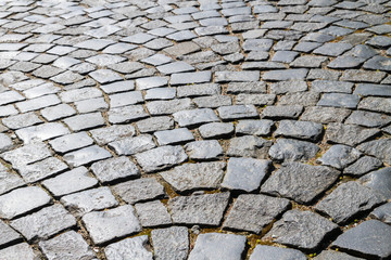 The road is paved with large stone