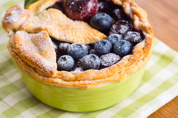 Decorated homemade shortcrust pastry berry pie with blueberries