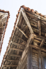 Fototapeta premium Old two wooden eaves on close house , Bulgaria