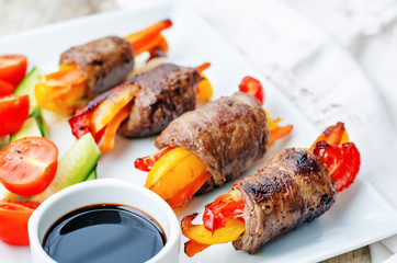 beef stuffed peppers, carrots and onions with balsamic dressing