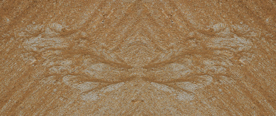 Fototapeta na wymiar Silhouette of butterfly wings made of sand and gravel by water