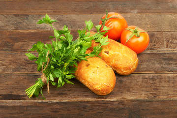 A loaf of corn bread and tomatoes © lucky_marinka