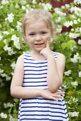 Close up portrait of a six year little girl, against background